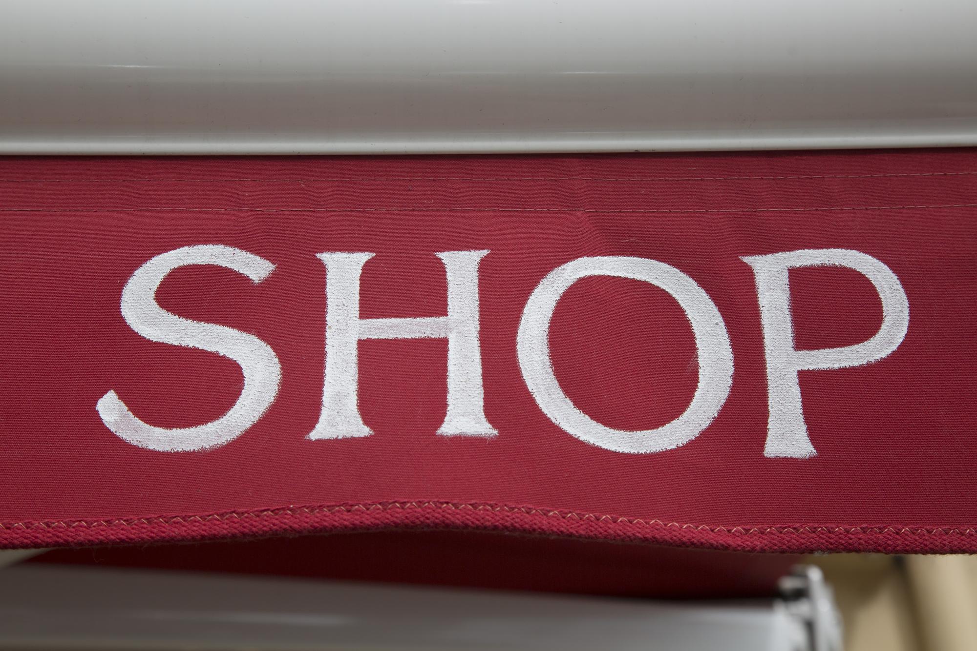 Exterior of embroidery studio with signage